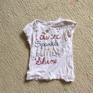 White shirt that says I love sparkle glitter shine